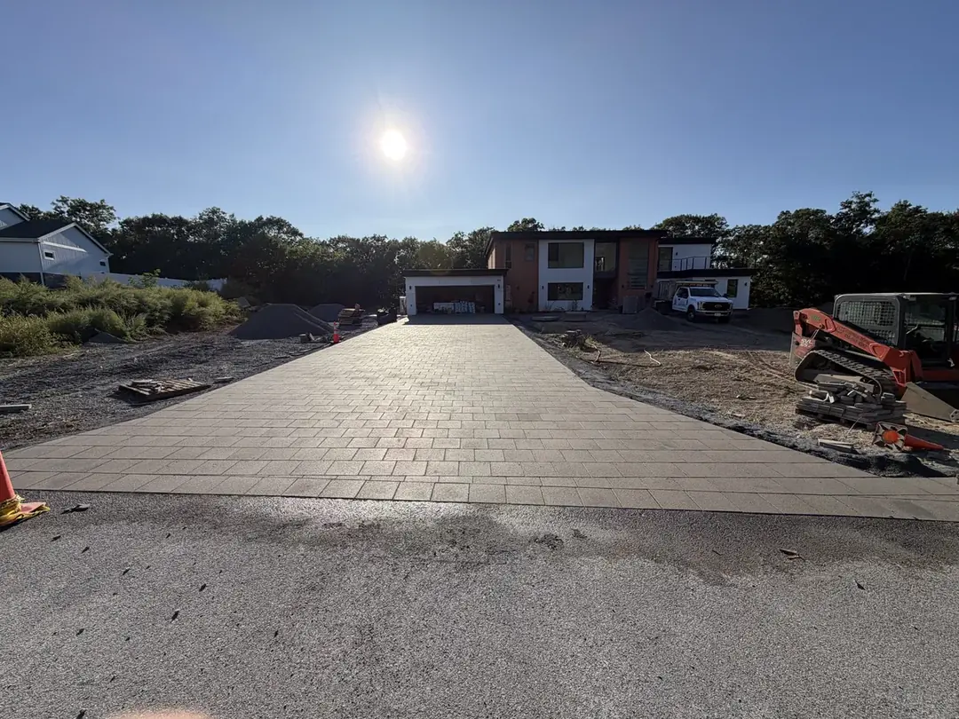 New paver driveway installed in front of a modern home